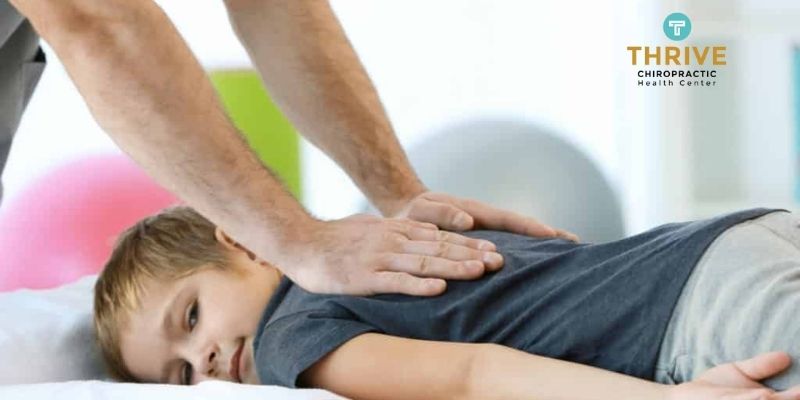 Chiropractic massage for children on spine and bone 